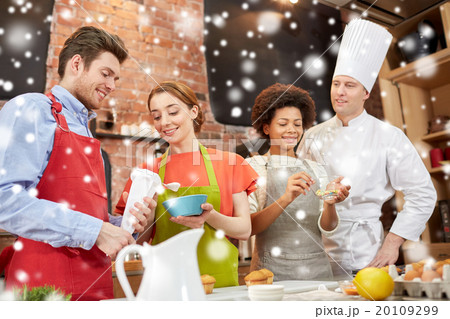 happy friends and chef cook baking in kitchen 20109299