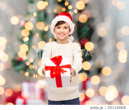 smiling happy boy in santa hat with gift box 20110008
