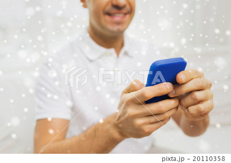 close up of happy man with smartphone at home 20110358