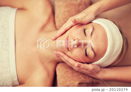 close up of young woman having face massage in spa 20110374