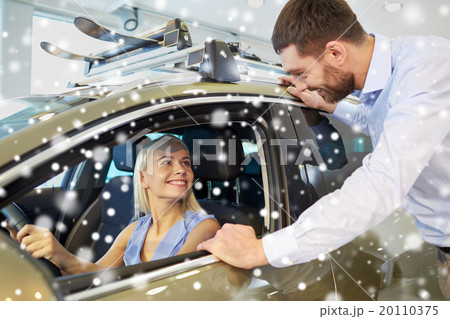 happy couple buying car in auto show or salon 20110375