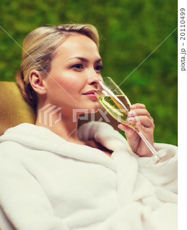 beautiful young woman drinking champagne at spa 20110499