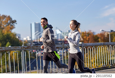 happy couple running outdoors happy couple running outdoors 20110502