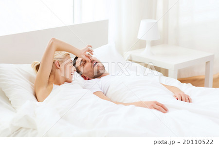 happy couple sleeping in bed at home 20110522