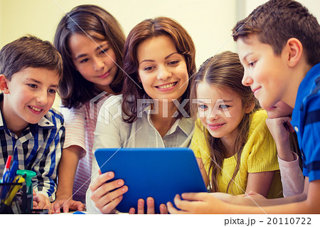 group of kids with teacher and tablet pc at school 20110722