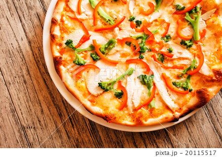 pizza on wooden background pizza on wooden background 20115517