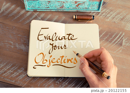 Handwritten text EVALUATE YOUR OBJECTIVES 20122155