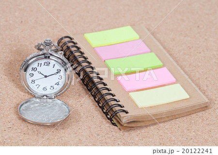 Pocket watch and note book on  background 20122241