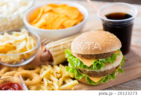 close up of fast food snacks and drink on table close up of fast food snacks and drink on table 20123273