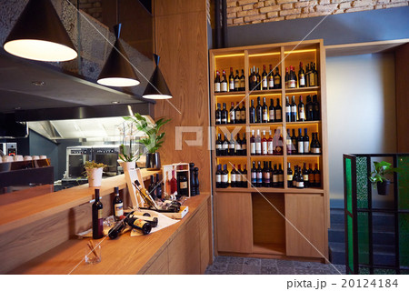 Wine bottles on a wooden shelf. Wine bottles on a wooden shelf. 20124184