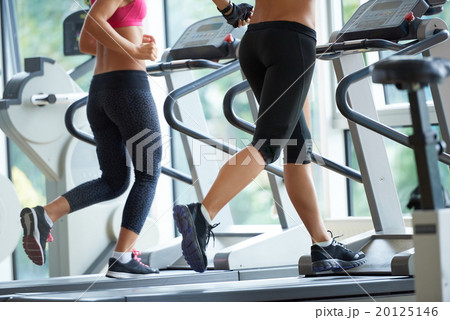 woman exercising on treadmill in gym 20125146