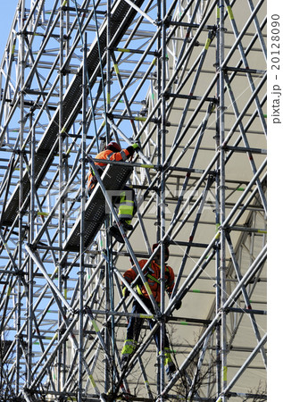 workers assemble metal construction 20128090