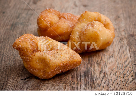 Bugne - french donut on wooden background 20128710