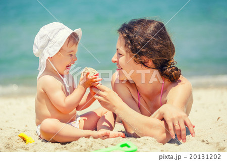 Mother with little daughter on the beach Mother with little daughter on the beach 20131202