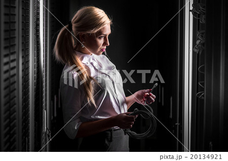 Engineer businesswoman in server room 20134921