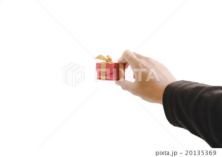 Hand holding little gift box, isolated on white 20135369