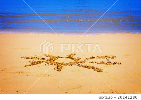 sun drawn on sandy beach 20141280