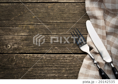 fork and knife on old wooden table 20142535