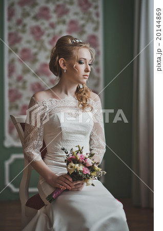 The girl looks towards a window 2725. The girl looks towards a window 2725. 20144869