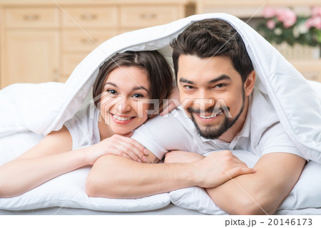 Nice loving couple lying in bed  20146173