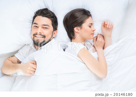 Nice loving couple lying in bed  20146180