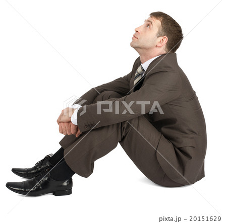 Businessman sitting and looking up 20151629