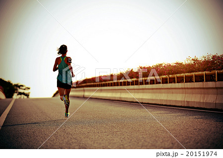 young fitness woman runner running at city road young fitness woman runner running at city road 20151974