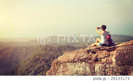 woman hiker use digital tablet on mountain peak 20153173