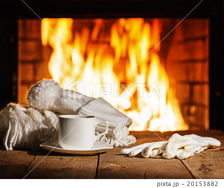 White cup of coffee or tea, woolen scarf, gloves White cup of coffee or tea, woolen scarf, gloves 20153882