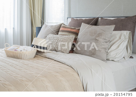 basket of crochet with hat on bed 20154795