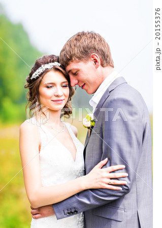 Stylish beautiful happy bride and groom in the 20155376