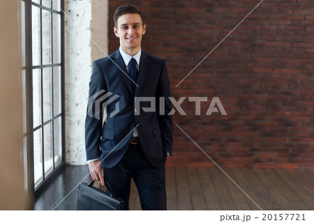 Portrait of businessman looking at camera, young Portrait of businessman looking at camera, young 20157721
