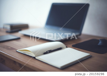 Stylish freelancer workspace with laptop open Stylish freelancer workspace with laptop open 20159296