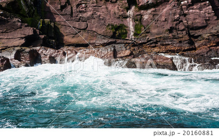 Water churning and waves crashing on rocky coast 20160881