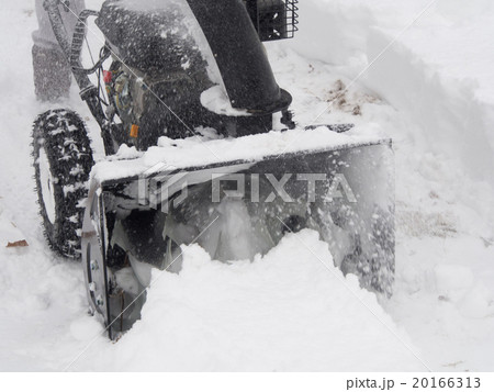 Snowblower at work on a winter day Snowblower at work on a winter day 20166313