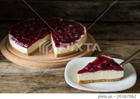 Wedge of cheesecake on the wooden table Wedge of cheesecake on the wooden table 20167062