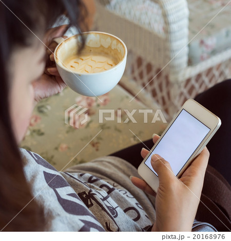 woman drinking hot coffee in cafe woman drinking hot coffee in cafe 20168976