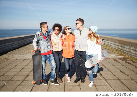 happy teenage friends with longboards on street 20170637