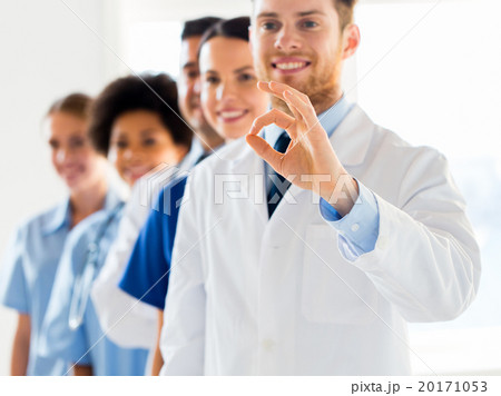 close up of doctors showing ok sign at hospital close up of doctors showing ok sign at hospital 20171053