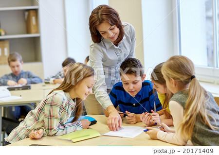 group of school kids writing test in classroom 20171409
