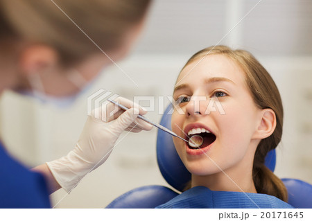 female dentist checking patient girl teeth female dentist checking patient girl teeth 20171645