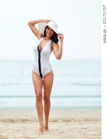 young woman in swimsuit posing on beach 20171707
