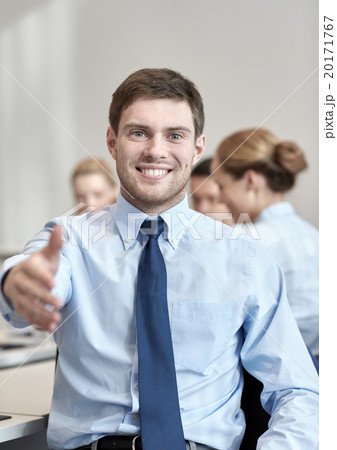 group of smiling businesspeople meeting in office group of smiling businesspeople meeting in office 20171767