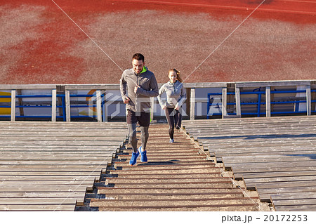 happy couple running upstairs on stadium happy couple running upstairs on stadium 20172253