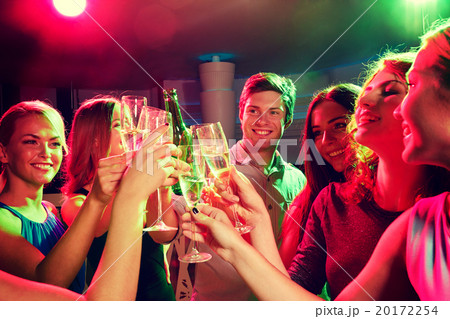 smiling friends with wine glasses and beer in club smiling friends with wine glasses and beer in club 20172254