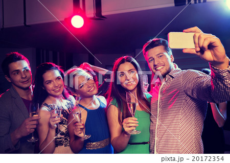 friends with glasses and smartphone in club 20172354
