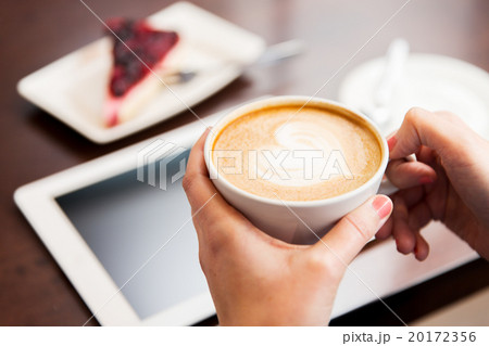 close up of hands with coffee, tablet pc and cake 20172356