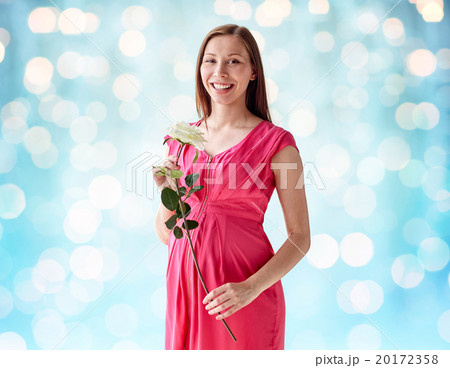 happy pregnant woman with rose flower happy pregnant woman with rose flower 20172358