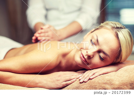 close up of woman lying and having massage in spa 20172399