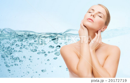 young woman touching her neck 20172719